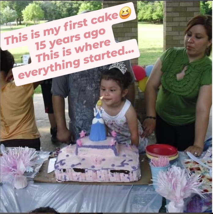Ana's daughter blowing out a candle on Ana's very first homemade birthday cake